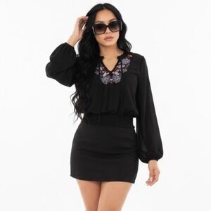 Chic Black Top with Floral Detail